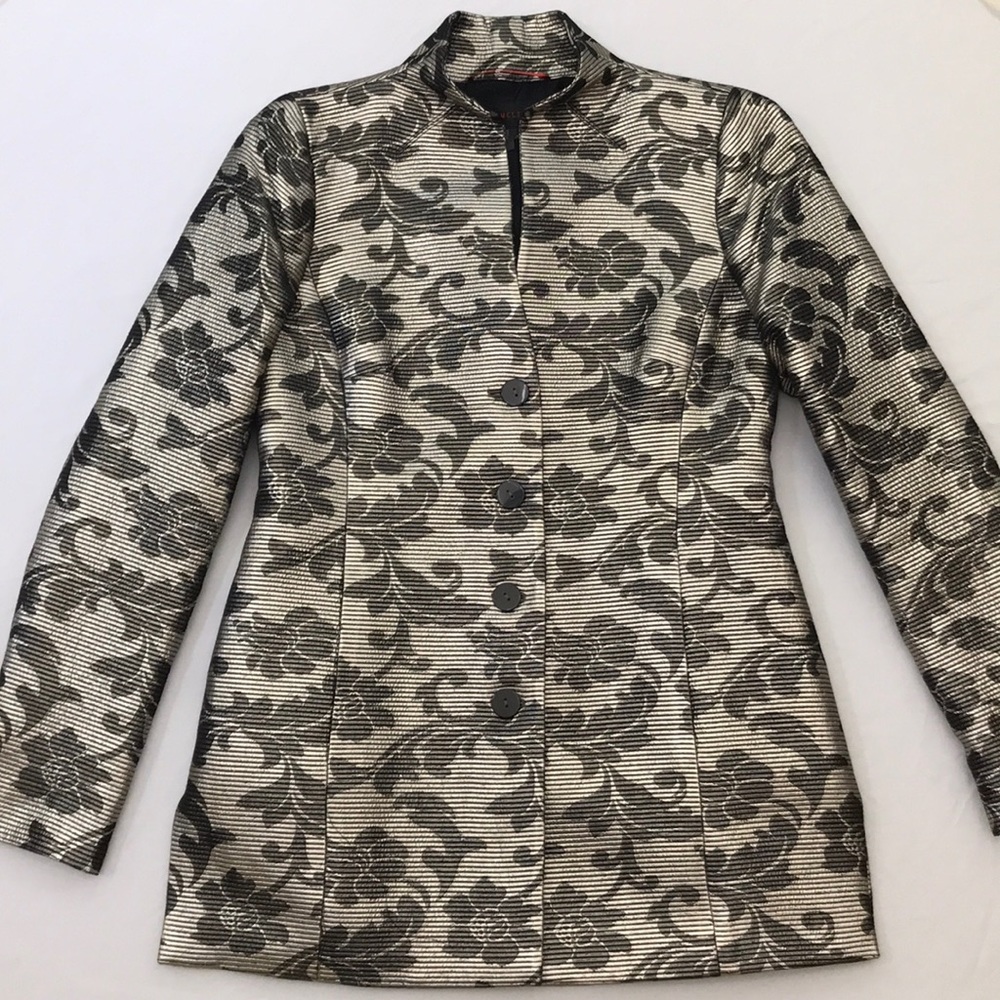 Women’s black and gold shimmer jacket.